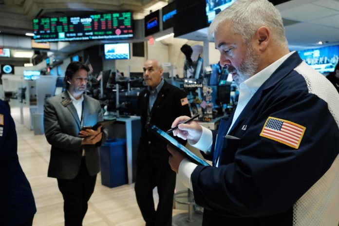 stocks-seesaw,-end-day-and-week-lower-after-cool-jobs-report:-stock-market-news-today