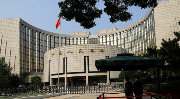 China surprises with modest rate cut amid growing yuan risks china-surprises-with-modest-rate-cut-amid-growing-yuan-risks