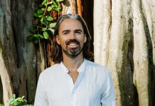 Venture Investing Meets Conscious Capital with Christopher Mackin Investor in white linen shirt by a tree—regenerative approach to venture and conscious capital.