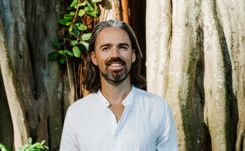 Venture Investing Meets Conscious Capital with Christopher Mackin Investor in white linen shirt by a tree—regenerative approach to venture and conscious capital.